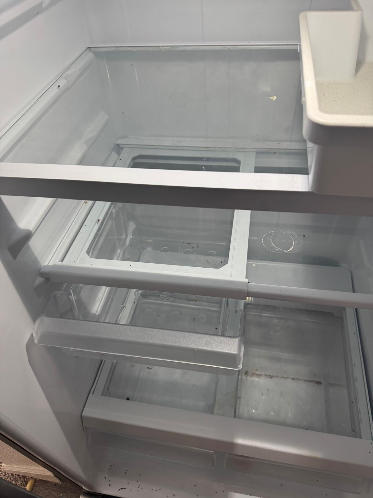 Refrigerator interior before deep cleaning service in Overland Park, KS