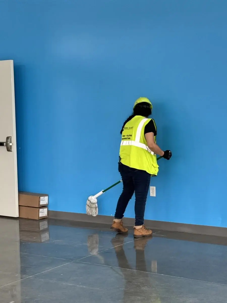 Cleaning along the lobby wall.