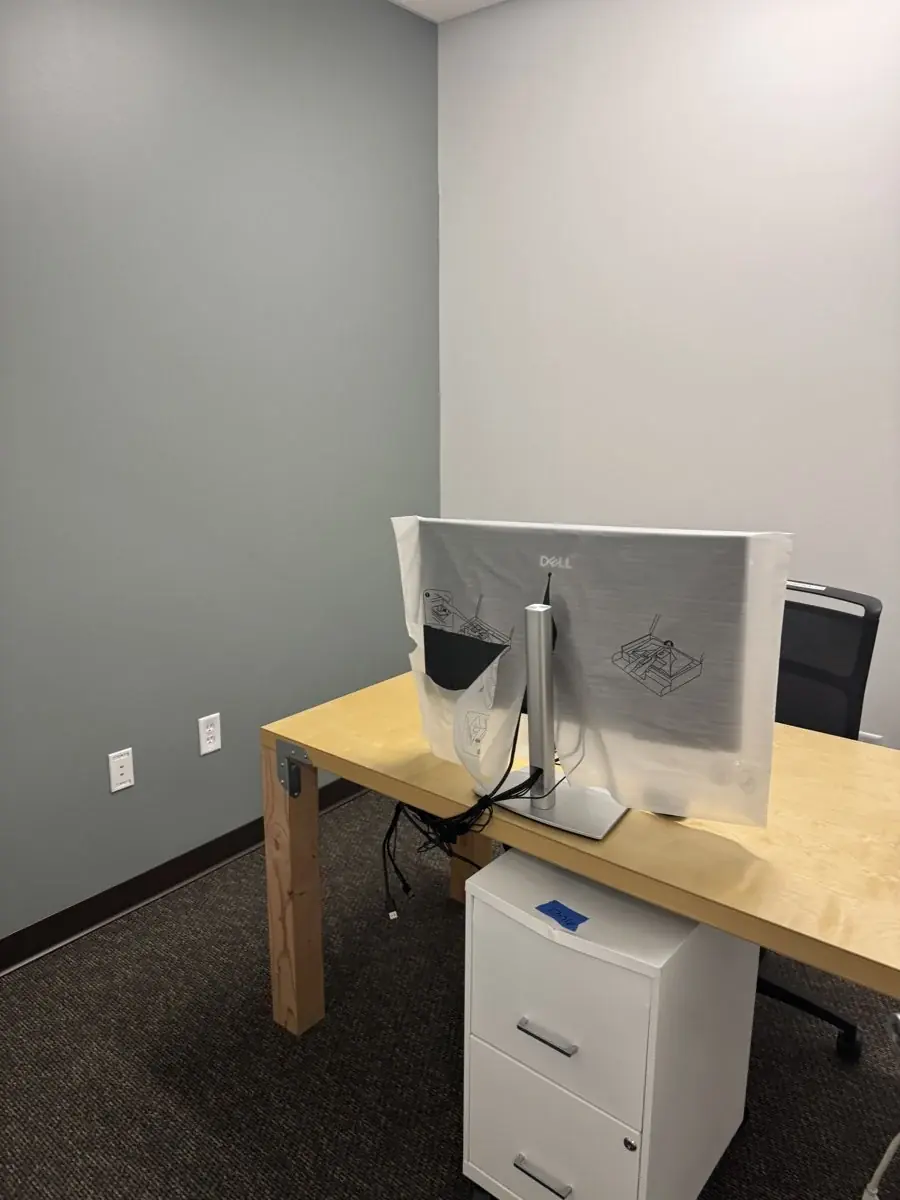 A tidy office desk and workstation.